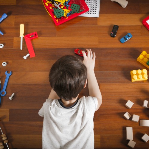 Kid playing toycars on vinyl floor | The Flooring Center