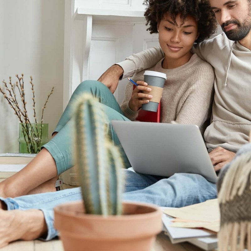 Couple look in laptop | The Flooring Center