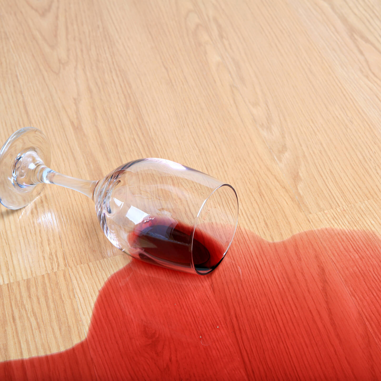 Red wine spill cleaning on laminate floor | The Flooring Center