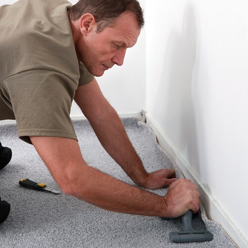 Man installing carpet | The Flooring Center