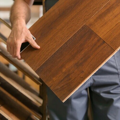 Man carry hardwood sample | The Flooring Center